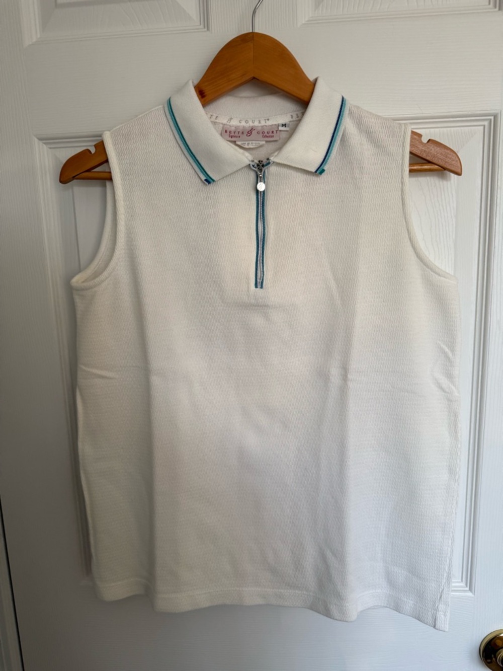 Bette & Court Signature Sleeveless Zip Polo in White with Teal Trim